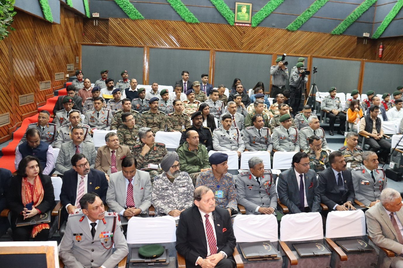 A group of men at a podiumAI-generated content may be incorrect.